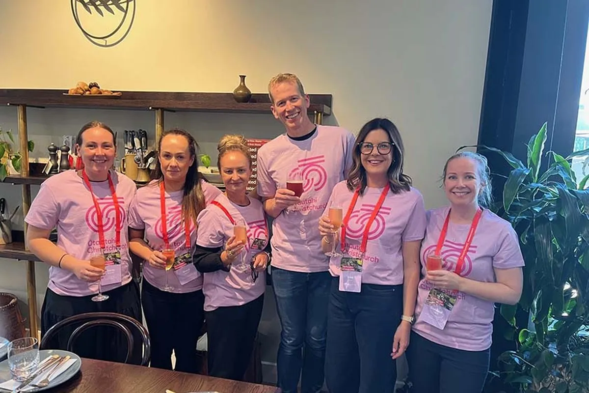 PCO Famil at Riverside Kitchen, group wearing matching pink tees