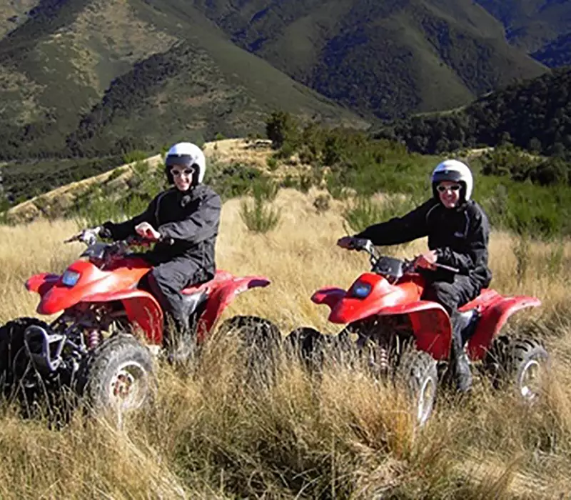 Two riders on Hanmer Adventure Quad Bikes in the hills
