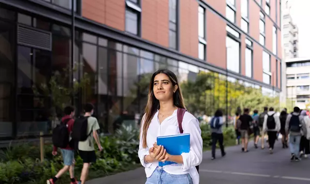 Student walking through campus