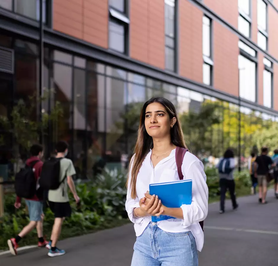 Student walking through campus