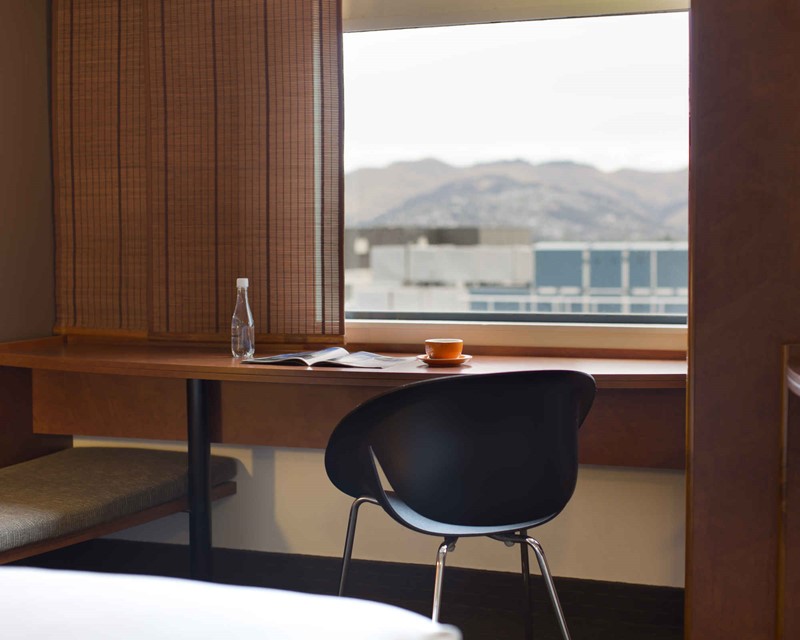 Standard Room, working desk by the window looking out across the city to the Port Hills