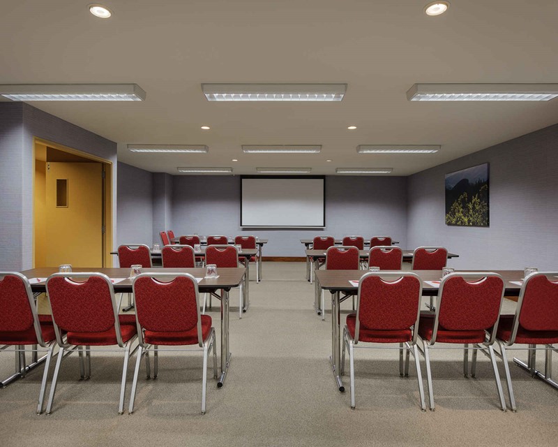 Ibis Conference room, classroom set up with trestle tables facing the front of the room