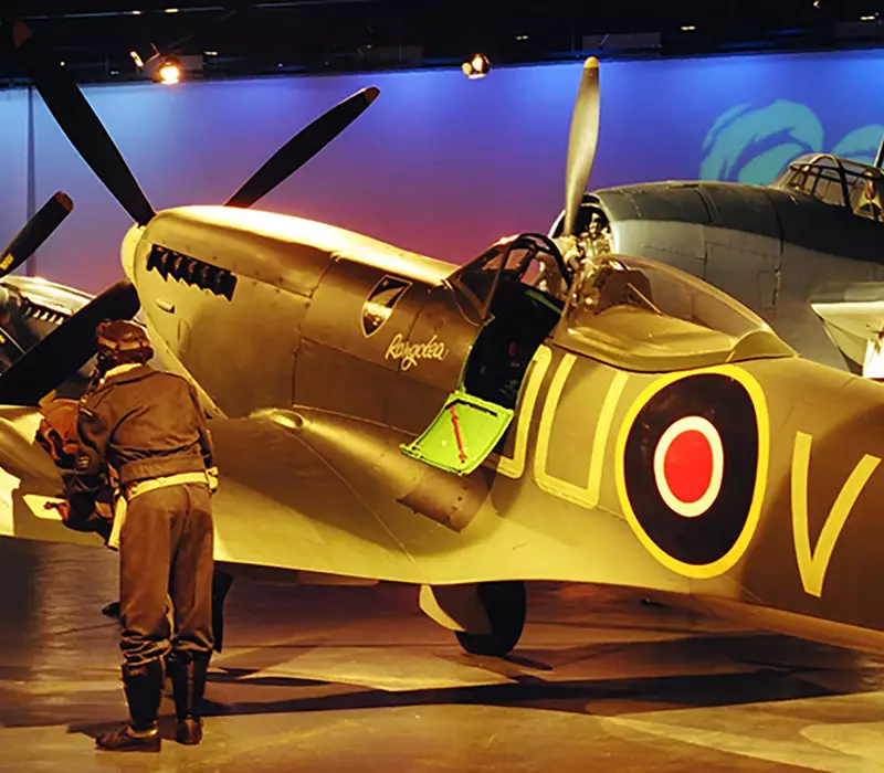 Air Force Museum of New Zealand Spitfire plane lit by spotlight. Located in the aircraft hall. 